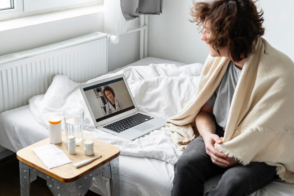Sick man having a video call with a doctor